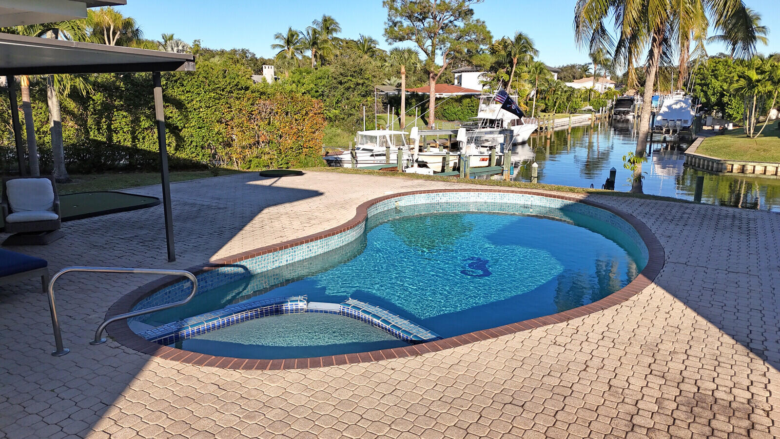 12980 Prosperity Farms Road Palm Beach Gardens, FL 33410 - Photo 46 of 55 a view of swimming pool with seating space