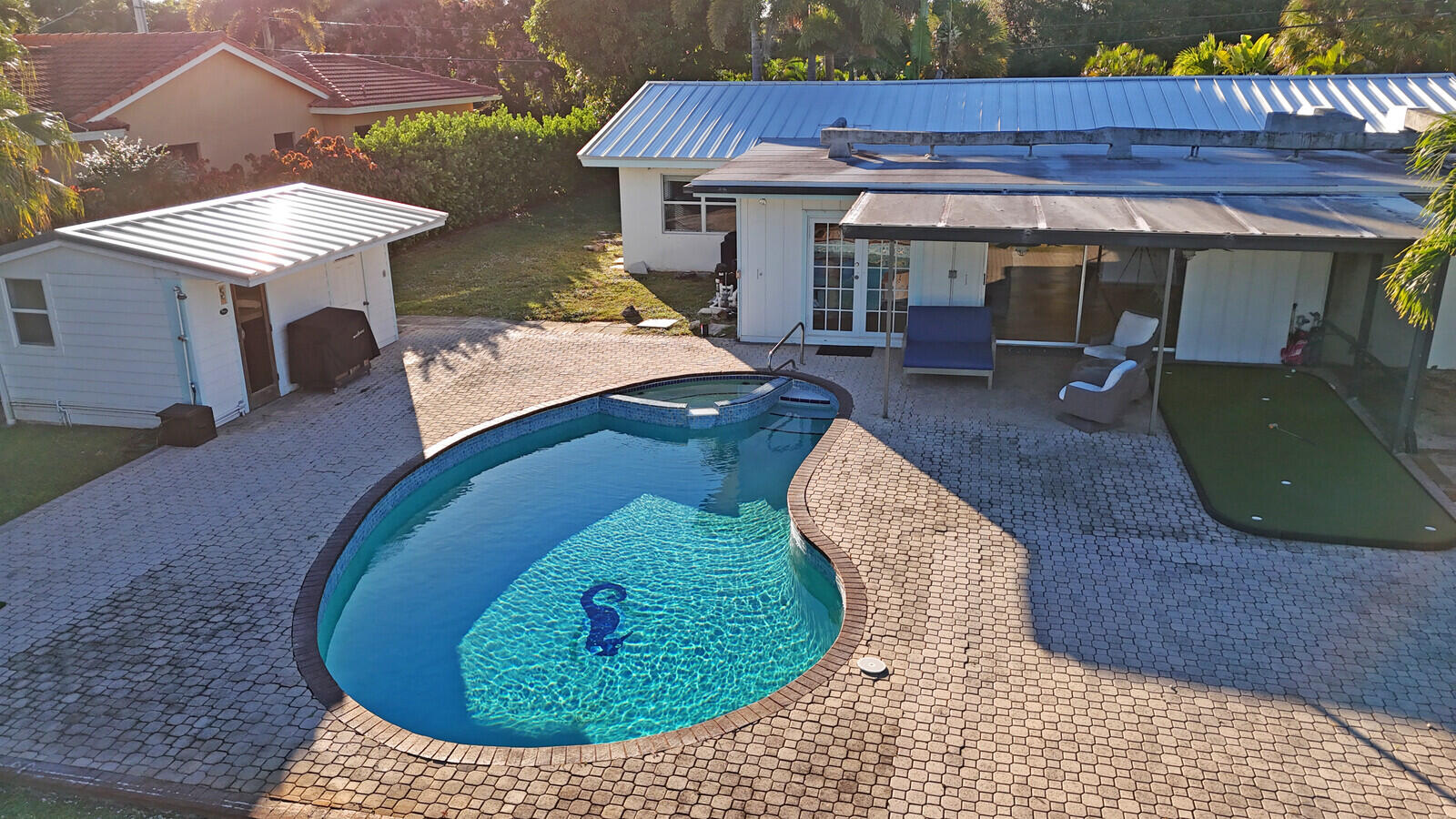 12980 Prosperity Farms Road Palm Beach Gardens, FL 33410 - Photo 47 of 55 a view of a dinning tables in front of house