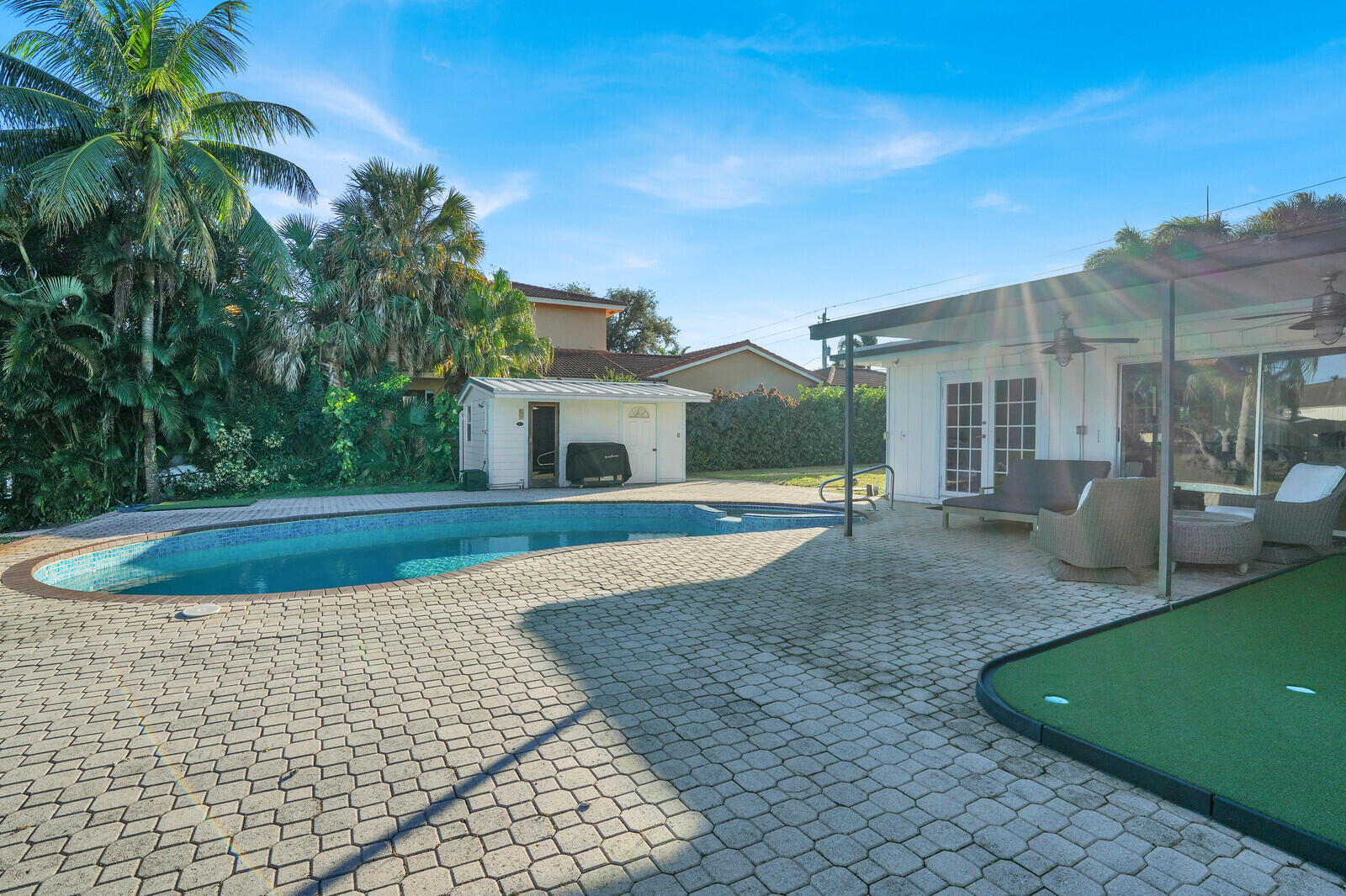 12980 Prosperity Farms Road Palm Beach Gardens, FL 33410 - Photo 48 of 55 a view of a house with a backyard