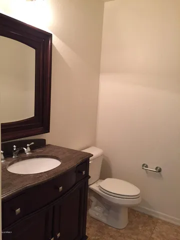 a view of room with wooden floor and windows