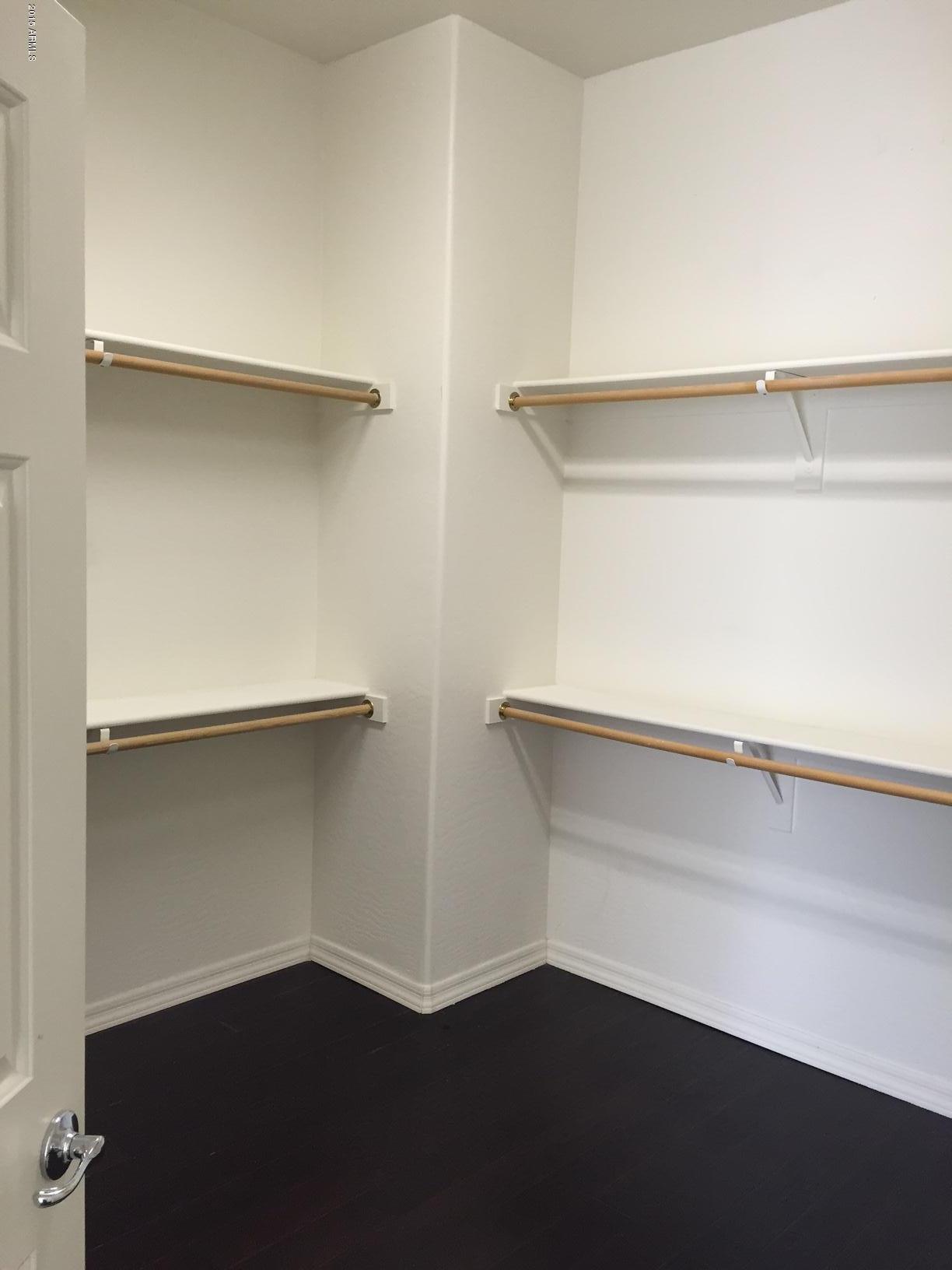 1502 East Dunlap Avenue, Unit 12 Phoenix, AZ 85020 - Photo 9 of 16 a view of an empty walk in closet
