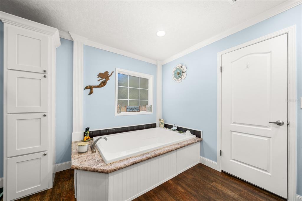 15405 Old Parker Island Road Lake Placid, FL 33852 - Photo 16 of 39 a bathroom with a granite countertop sink and a mirror