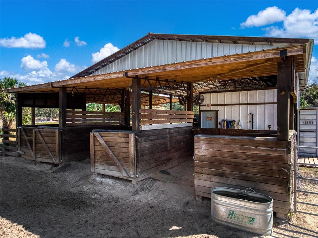15405 Old Parker Island Road Lake Placid, FL 33852 - Photo 31 of 39 a view of a patio with table and chairs