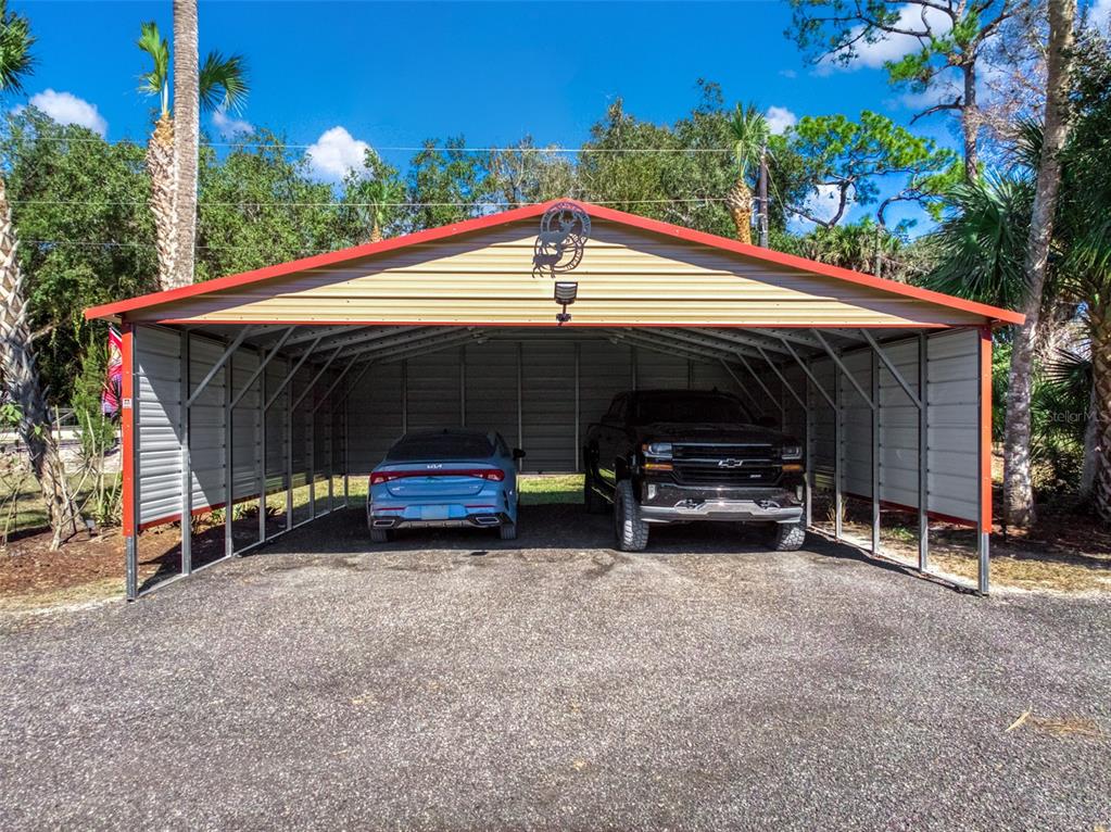 15405 Old Parker Island Road Lake Placid, FL 33852 - Photo 33 of 39 a view of backyard with car parked