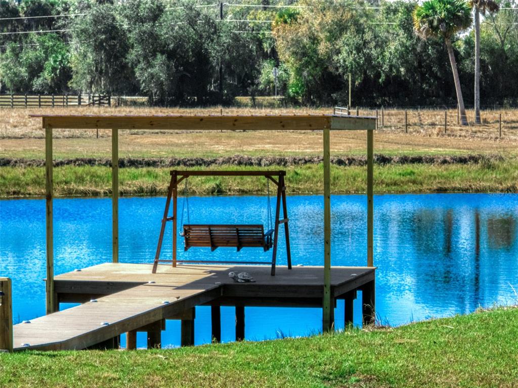 15405 Old Parker Island Road Lake Placid, FL 33852 - Photo 38 of 39 a view of a house with a yard and sitting area