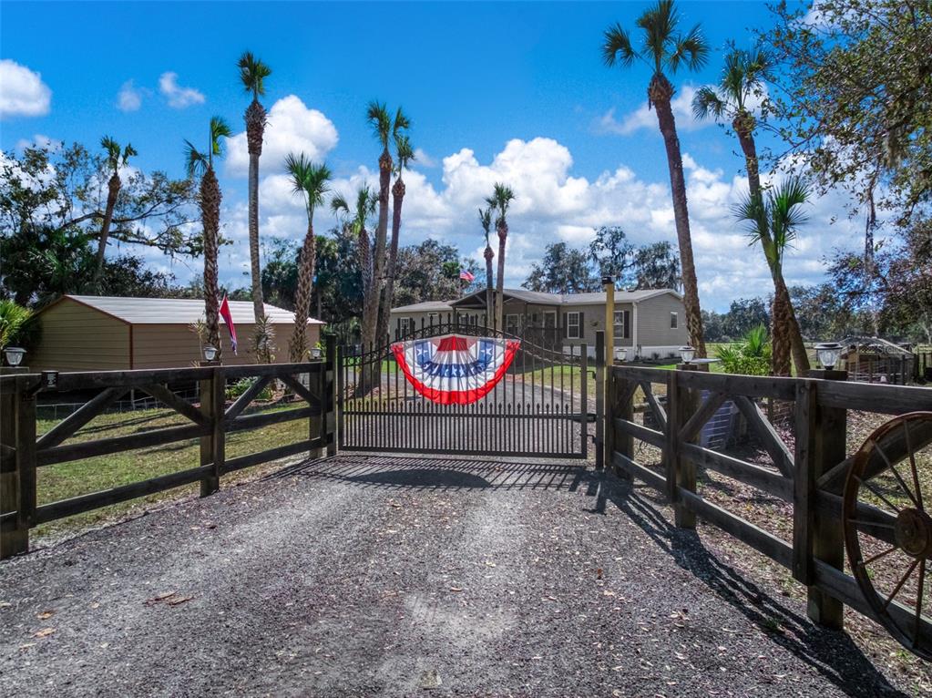 15405 Old Parker Island Road Lake Placid, FL 33852 - Photo 6 of 39 a view of a street with sitting area