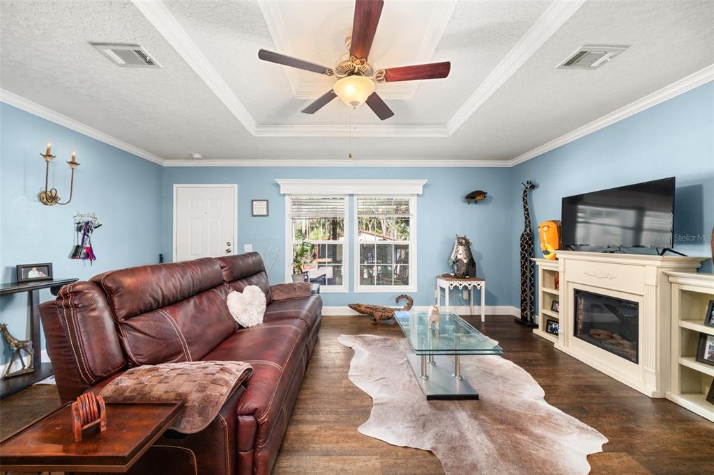 15405 Old Parker Island Road Lake Placid, FL 33852 - Photo 7 of 39 a living room with furniture fireplace and flat screen tv