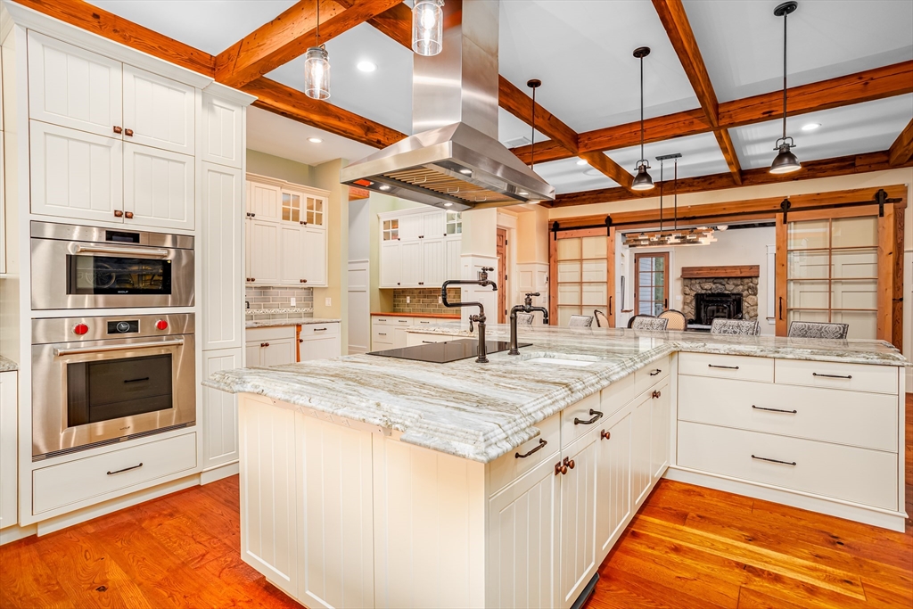 210 Indian Hill Road Groton, MA 01450 - Photo 11 of 42 a kitchen with stainless steel appliances granite countertop a stove a sink and a microwave