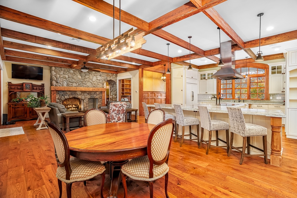 210 Indian Hill Road Groton, MA 01450 - Photo 13 of 42 a view of a dining room with furniture a chandelier and wooden floor