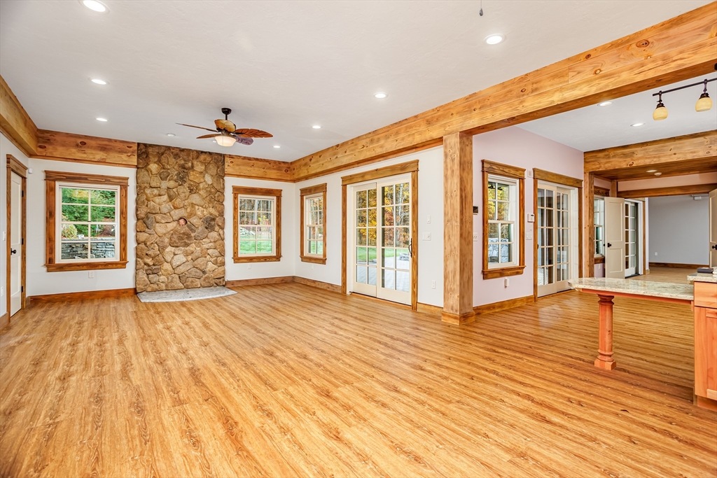 210 Indian Hill Road Groton, MA 01450 - Photo 26 of 42 a view of livingroom with an entryway and wooden floor