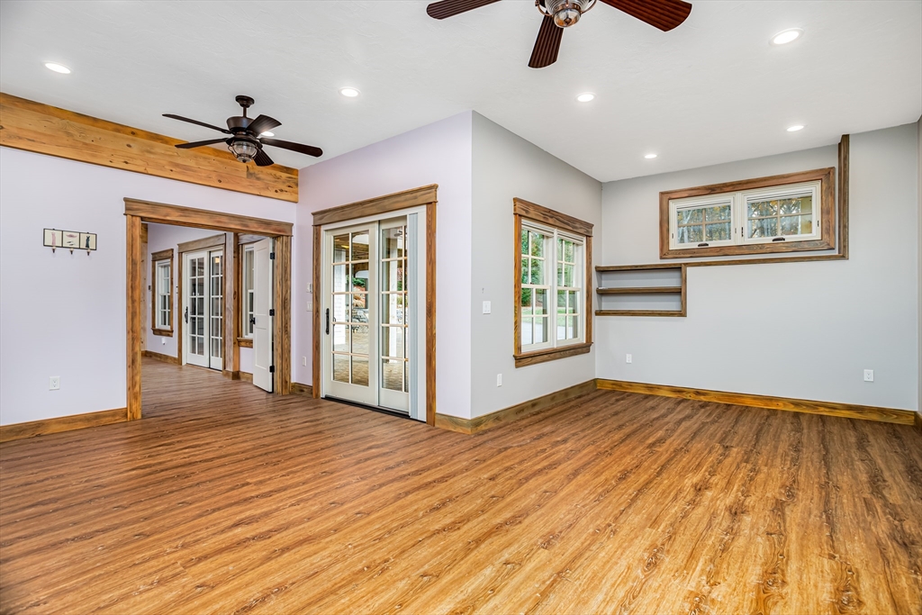 210 Indian Hill Road Groton, MA 01450 - Photo 28 of 42 a view of an empty room with window and wooden floor