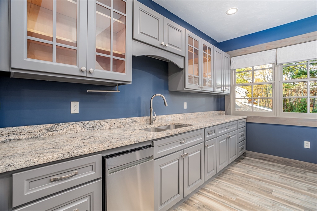 210 Indian Hill Road Groton, MA 01450 - Photo 33 of 42 a kitchen with stainless steel appliances granite countertop a sink and a window