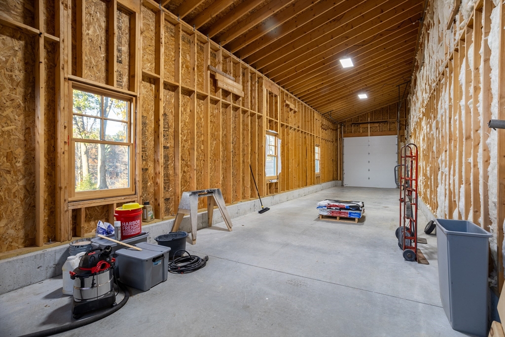 210 Indian Hill Road Groton, MA 01450 - Photo 38 of 42 a bedroom with furniture and a large window