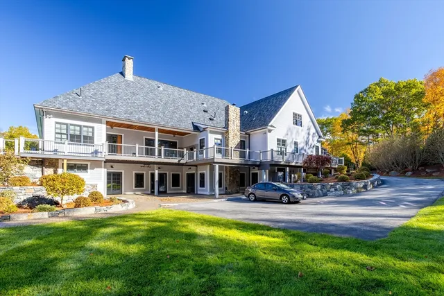 a view of a house with a yard porch and sitting area