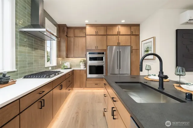 a kitchen with a stove a sink and a refrigerator