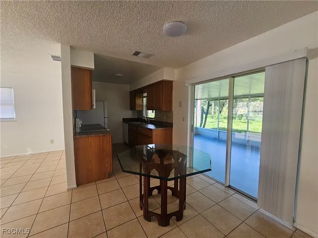 a kitchen with stainless steel appliances granite countertop a sink and a stove