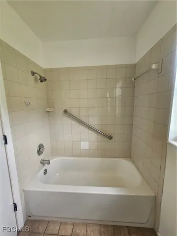 a view of an empty room with a large window