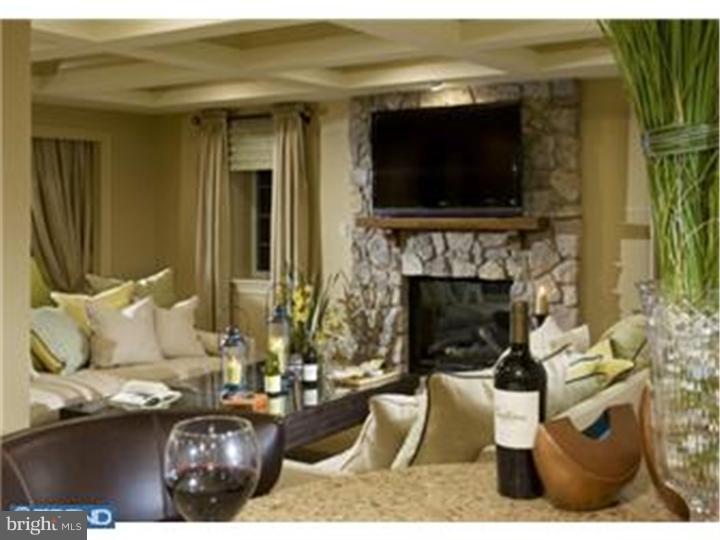 230 Valley Ridge Road Haverford, PA 19041 - Photo 12 of 15 a living room with furniture a flat screen tv and a fireplace