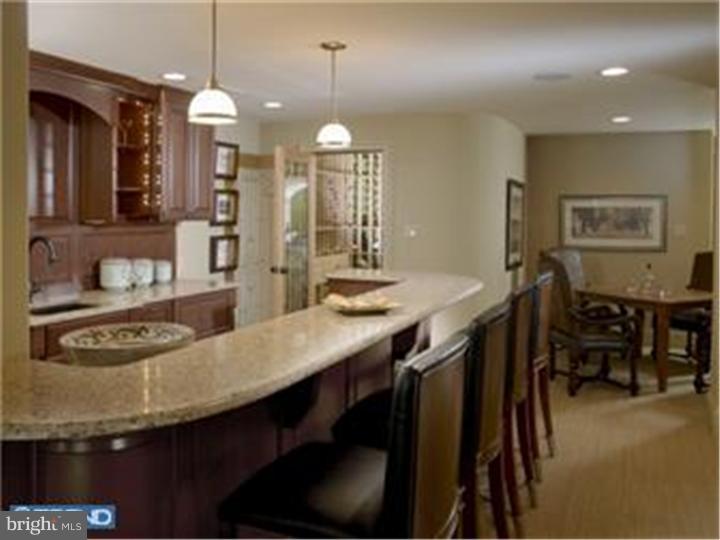 230 Valley Ridge Road Haverford, PA 19041 - Photo 14 of 15 a kitchen with granite countertop a stove a sink a dining table and chairs