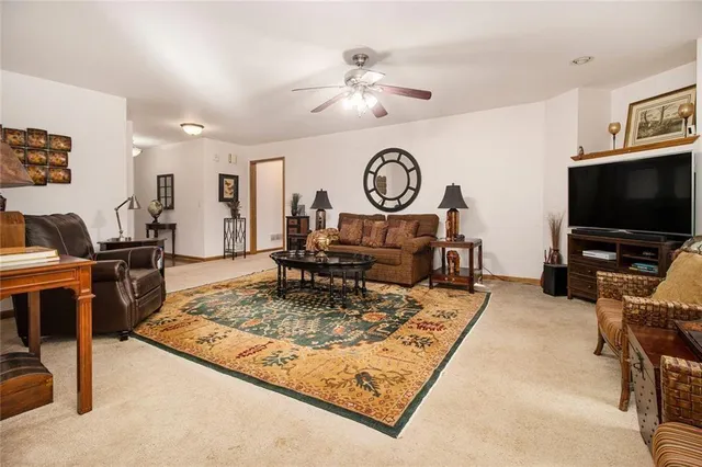 a spacious bathroom with a sink a mirror and a toilet