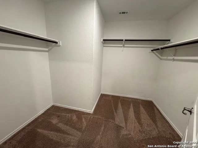 a view of a room with racks on the wall