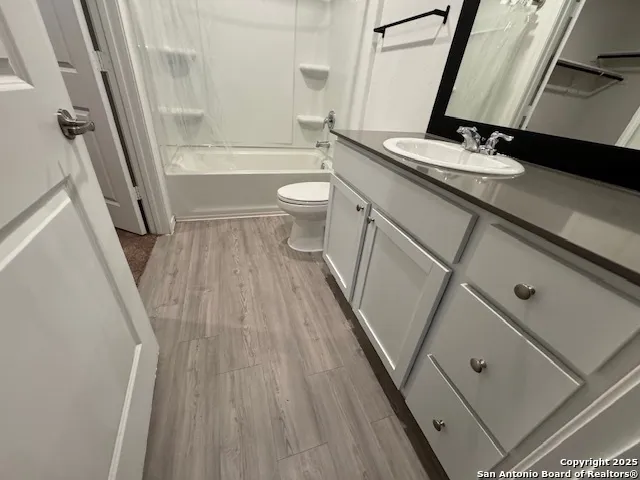 a bathroom with a sink a toilet and a bathtub