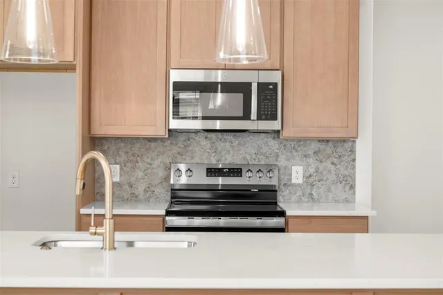 a view of kitchen with cabinets and wooden floor