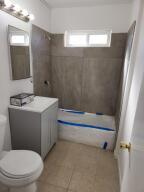 10485 Santa Cruz Road Desert Hot Springs, CA 92240 - Photo 16 of 16 a bathroom with a sink a toilet and shower