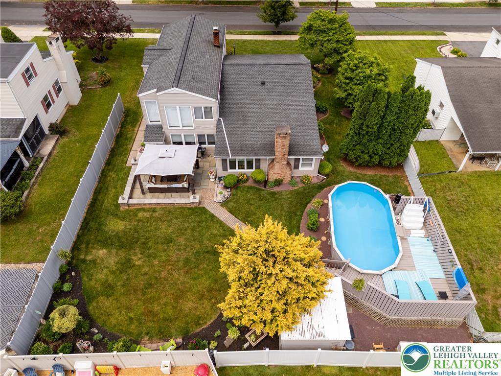 2087 Hopewell Road Bethlehem, PA 18017 - Photo 36 of 38 An aerial perspective reveals a private yard with an inviting above-ground pool and an outdoor living area.