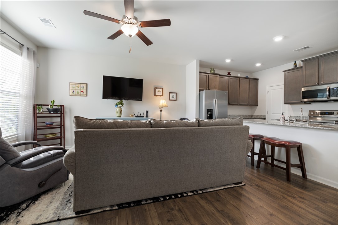 104 Village Main Anderson, SC 29621 - Photo 5 of 32 This inviting space combines a cozy living area with a functional, open-concept kitchen.