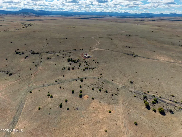 a view of a balcony with chair and table