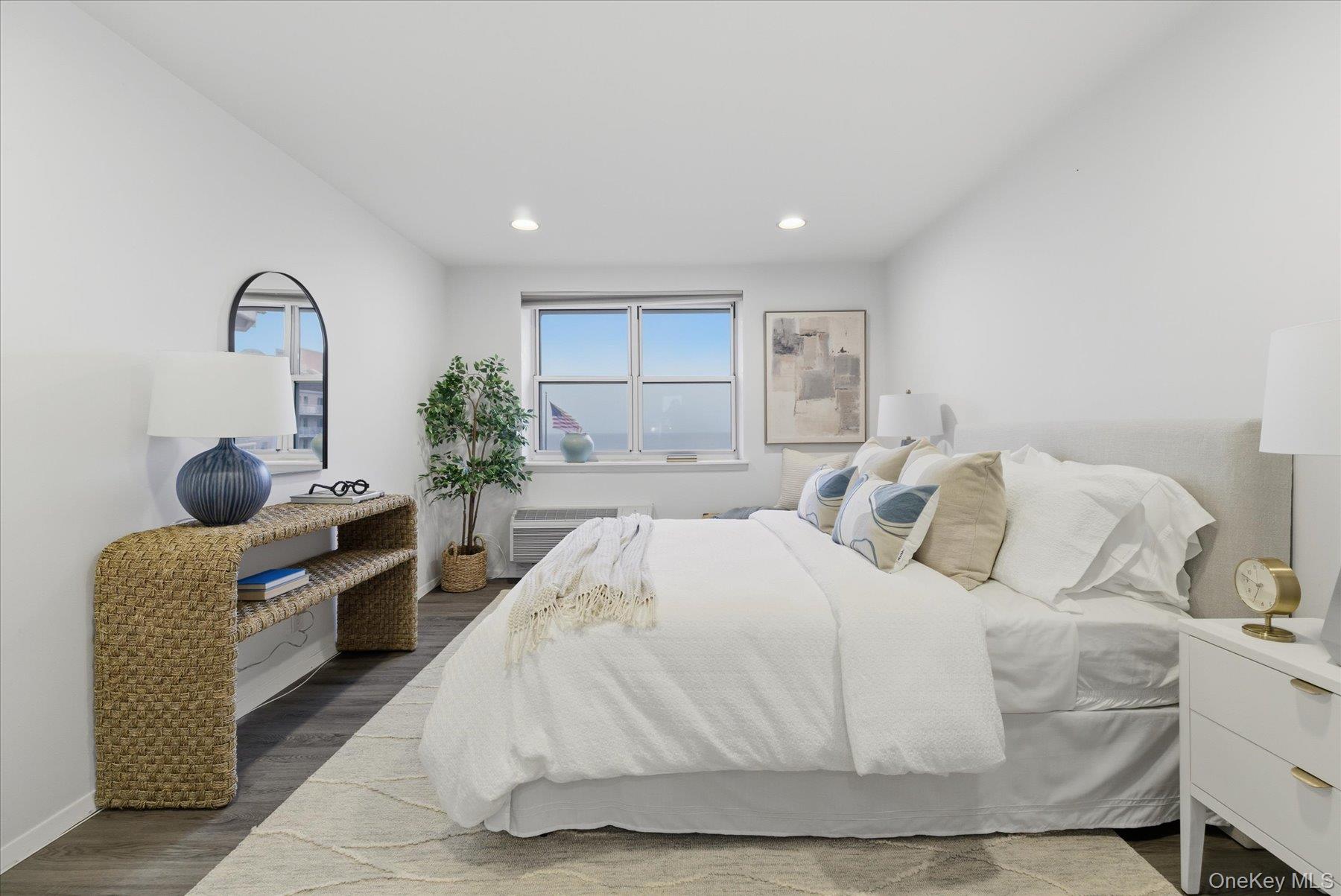 2 Richmond Road, Unit 4A Lido Beach, NY 11561 - Photo 11 of 33 a large white bed in a white room