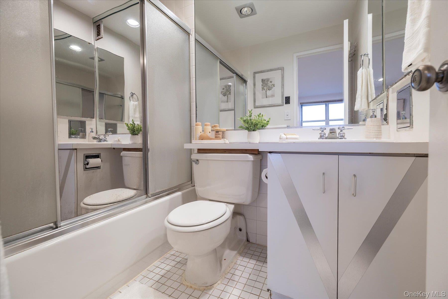 2 Richmond Road, Unit 4A Lido Beach, NY 11561 - Photo 14 of 33 a bathroom with a sink toilet and shower