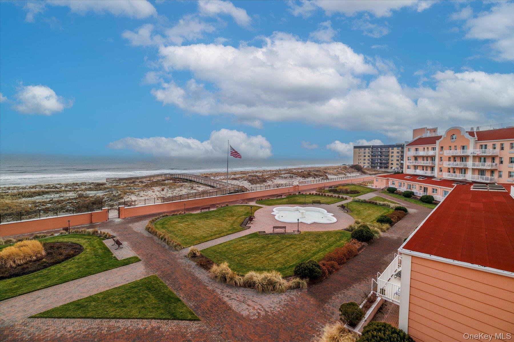 2 Richmond Road, Unit 4A Lido Beach, NY 11561 - Photo 16 of 33 a view of a swimming pool with an ocean view
