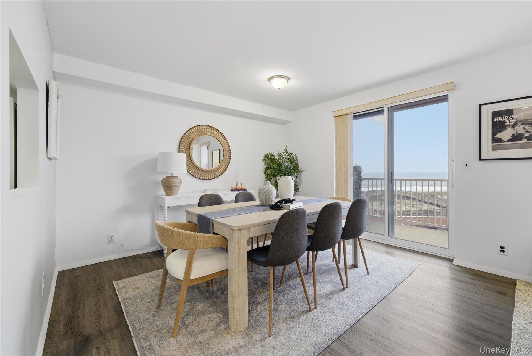 2 Richmond Road, Unit 4A Lido Beach, NY 11561 - Photo 3 of 33 a view of a dining room with furniture window and wooden floor