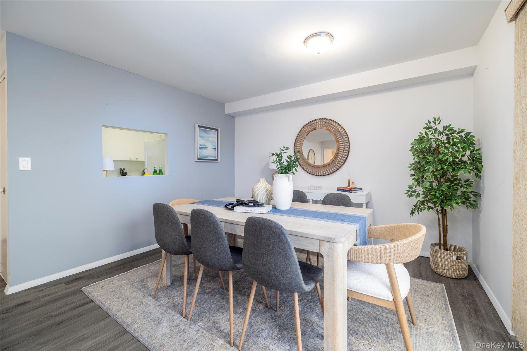 2 Richmond Road, Unit 4A Lido Beach, NY 11561 - Photo 4 of 33 a view of a dining room with furniture and wooden floor