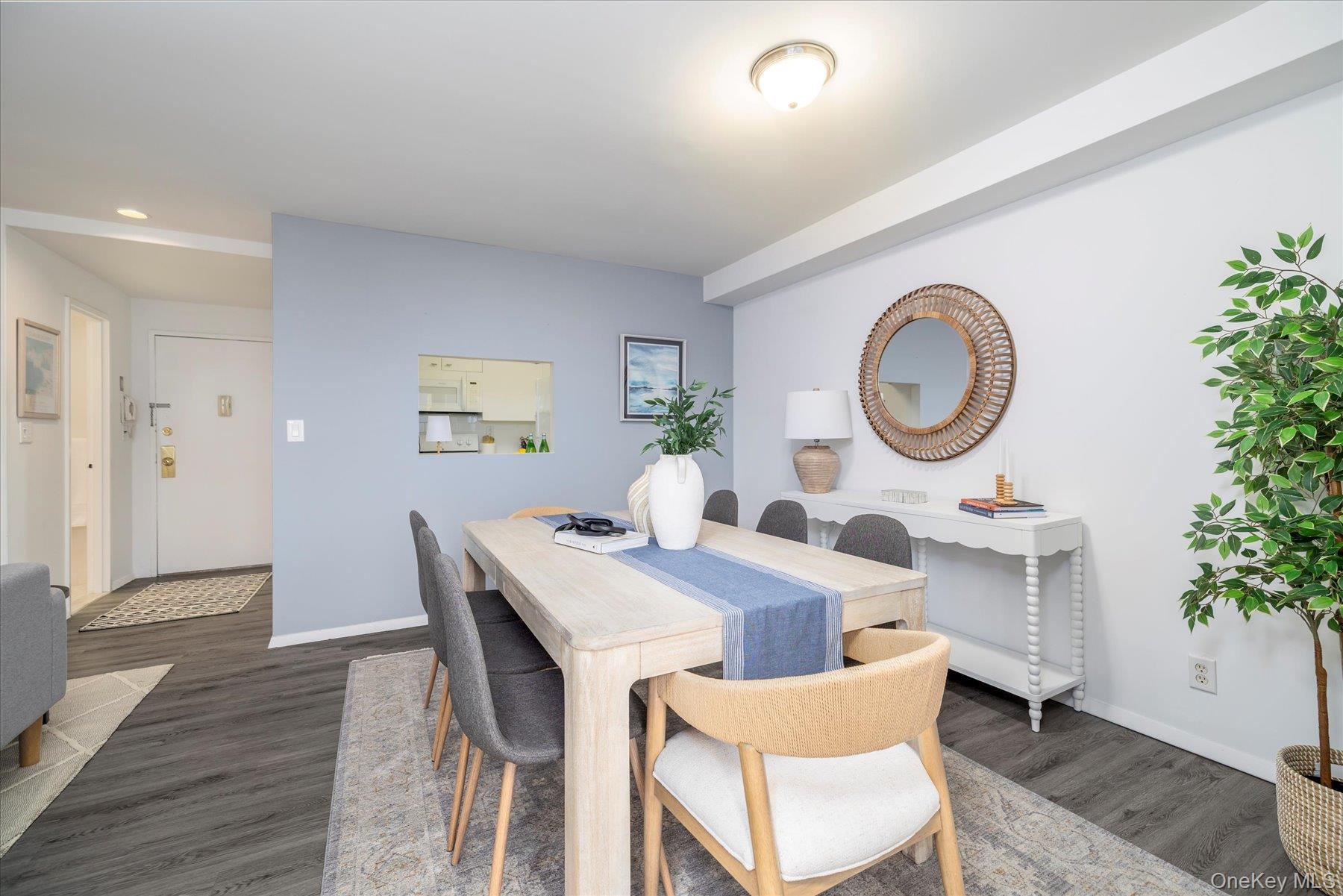 2 Richmond Road, Unit 4A Lido Beach, NY 11561 - Photo 5 of 33 a living room with a dining table with wooden floor