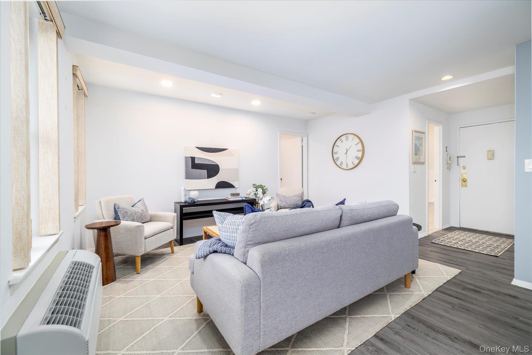 2 Richmond Road, Unit 4A Lido Beach, NY 11561 - Photo 7 of 33 a living room with furniture and a rug