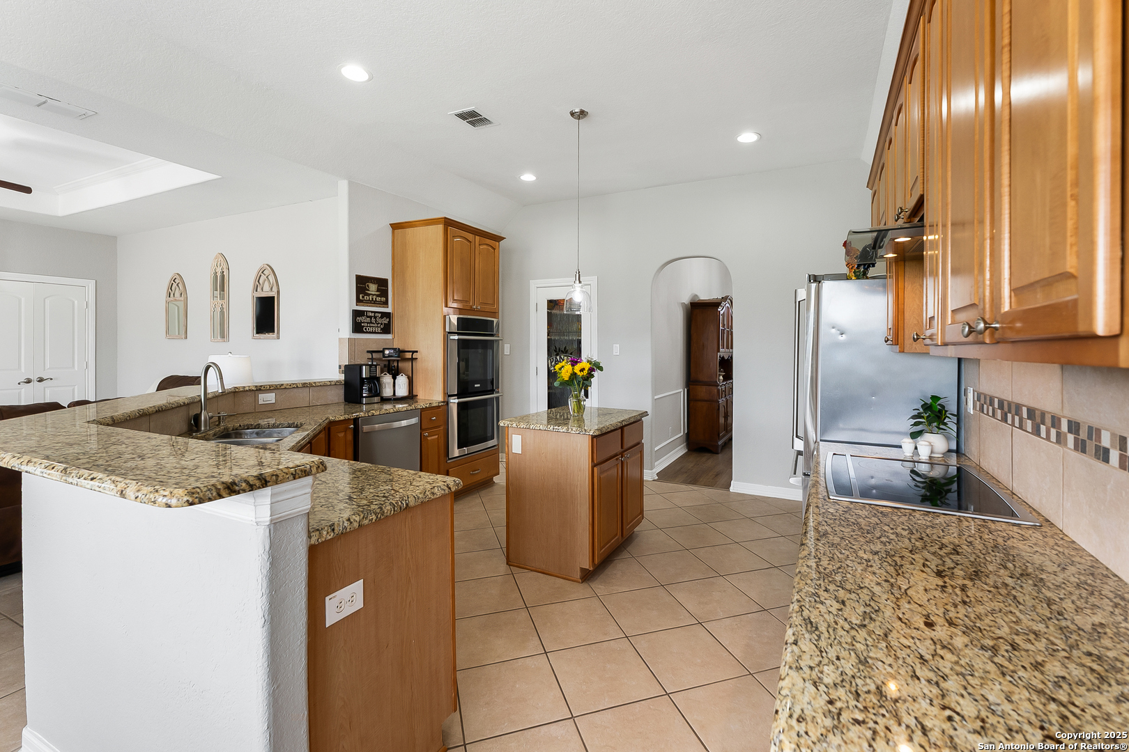 701 Kreutzberg Road Boerne, TX 78006 - Photo 11 of 43 a large kitchen with stainless steel appliances granite countertop a sink and cabinets