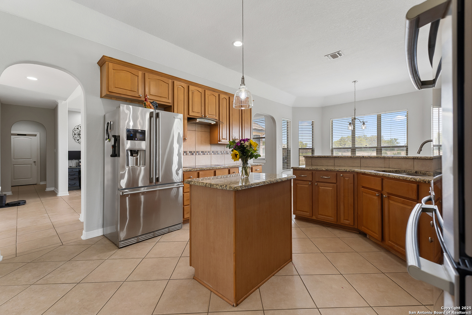 701 Kreutzberg Road Boerne, TX 78006 - Photo 12 of 43 a kitchen with stainless steel appliances granite countertop a refrigerator and a sink