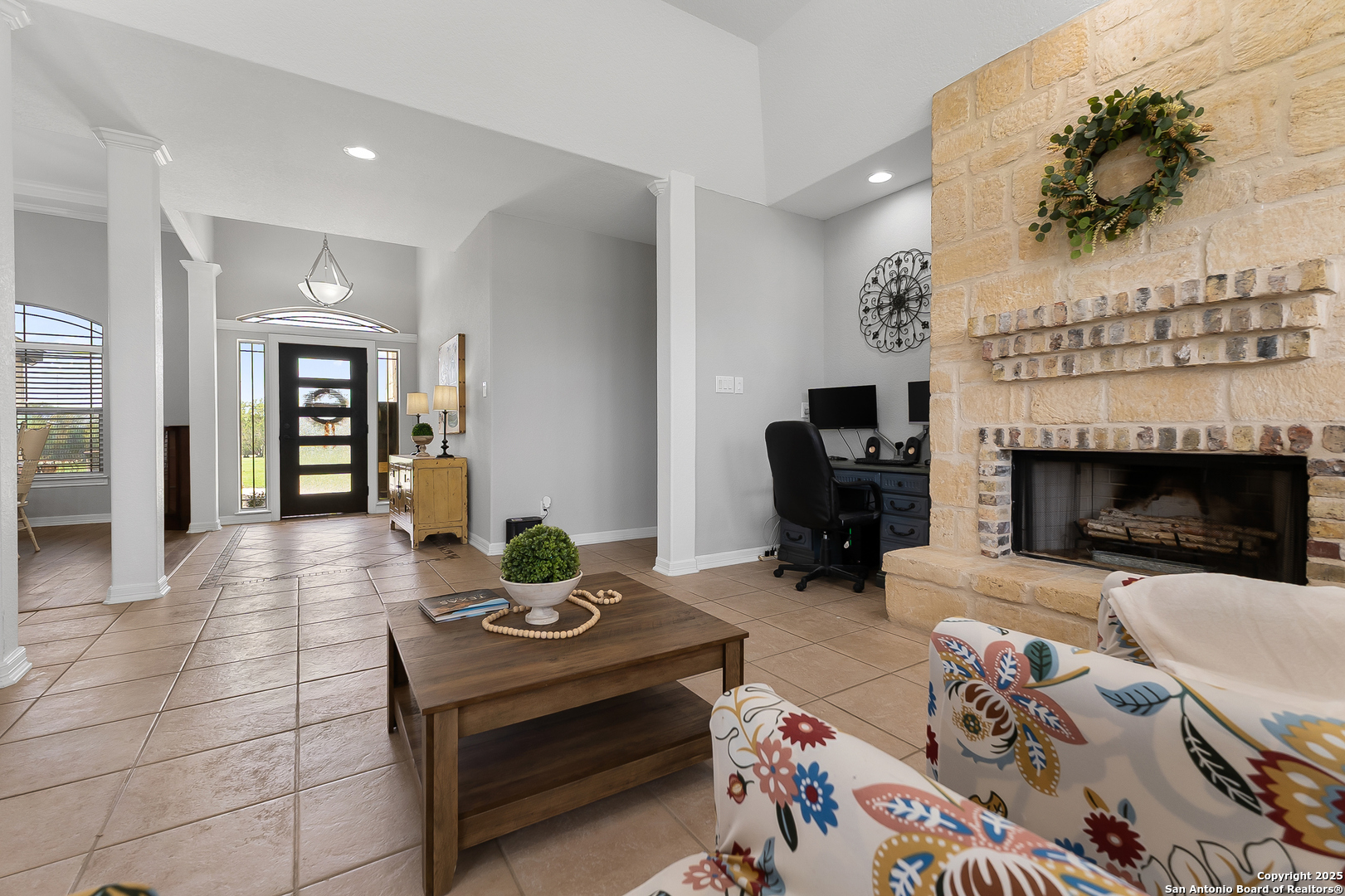 701 Kreutzberg Road Boerne, TX 78006 - Photo 16 of 43 a living room with furniture and a fireplace