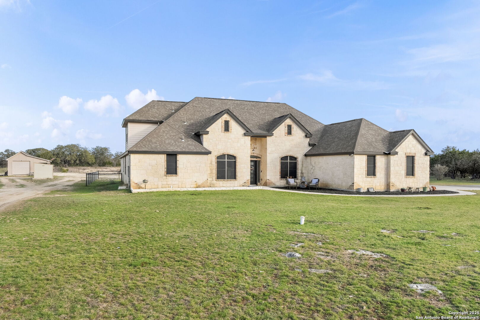 701 Kreutzberg Road Boerne, TX 78006 - Photo 2 of 43 a front view of a house with a yard