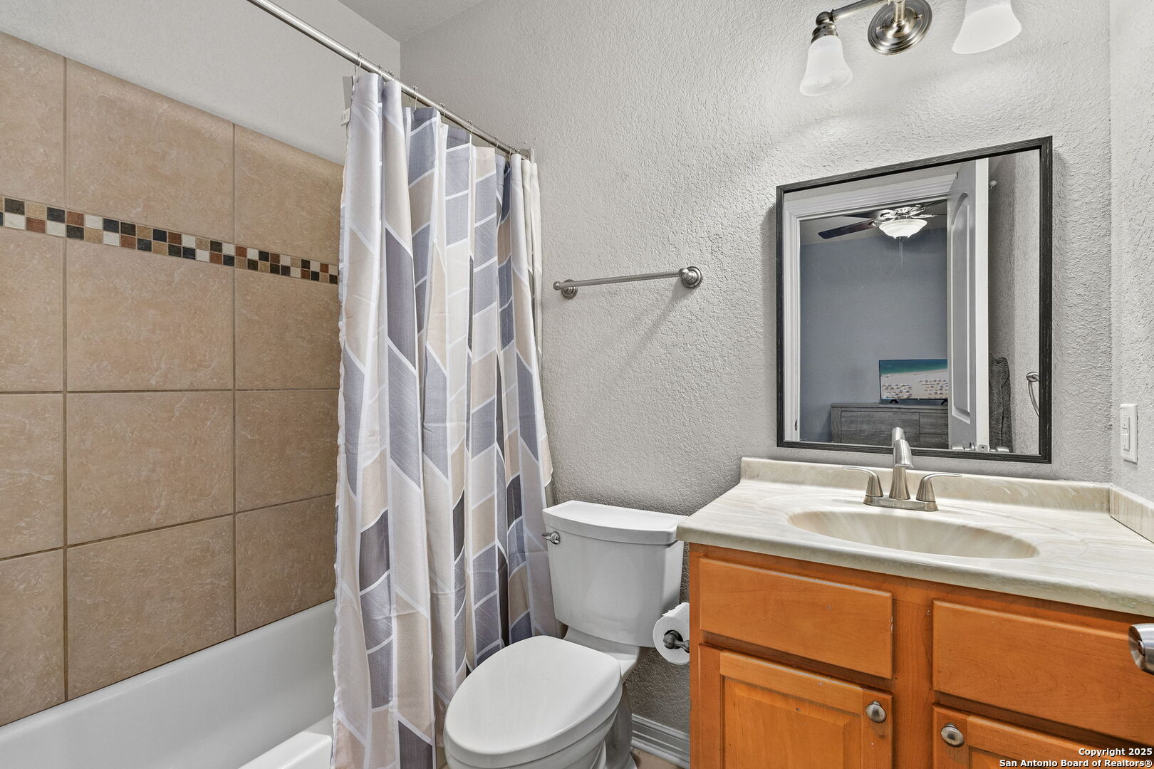 701 Kreutzberg Road Boerne, TX 78006 - Photo 25 of 43 a bathroom with a sink a toilet and shower