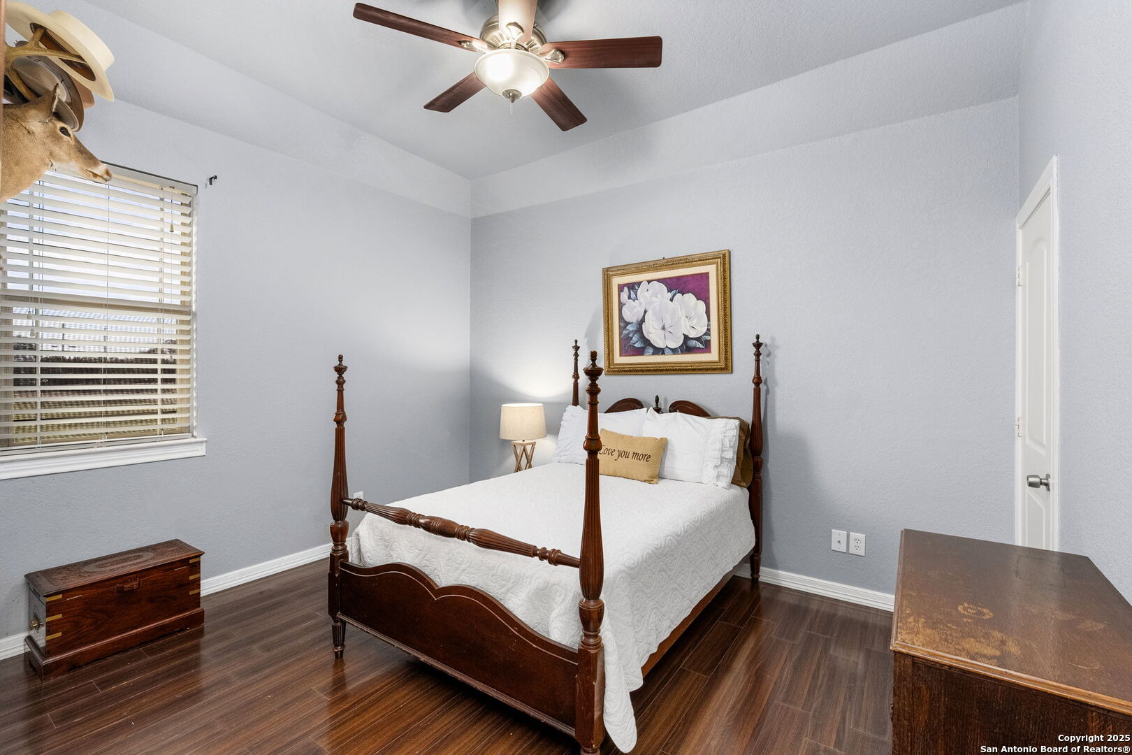 701 Kreutzberg Road Boerne, TX 78006 - Photo 26 of 43 a bed room with a bed and a lamp