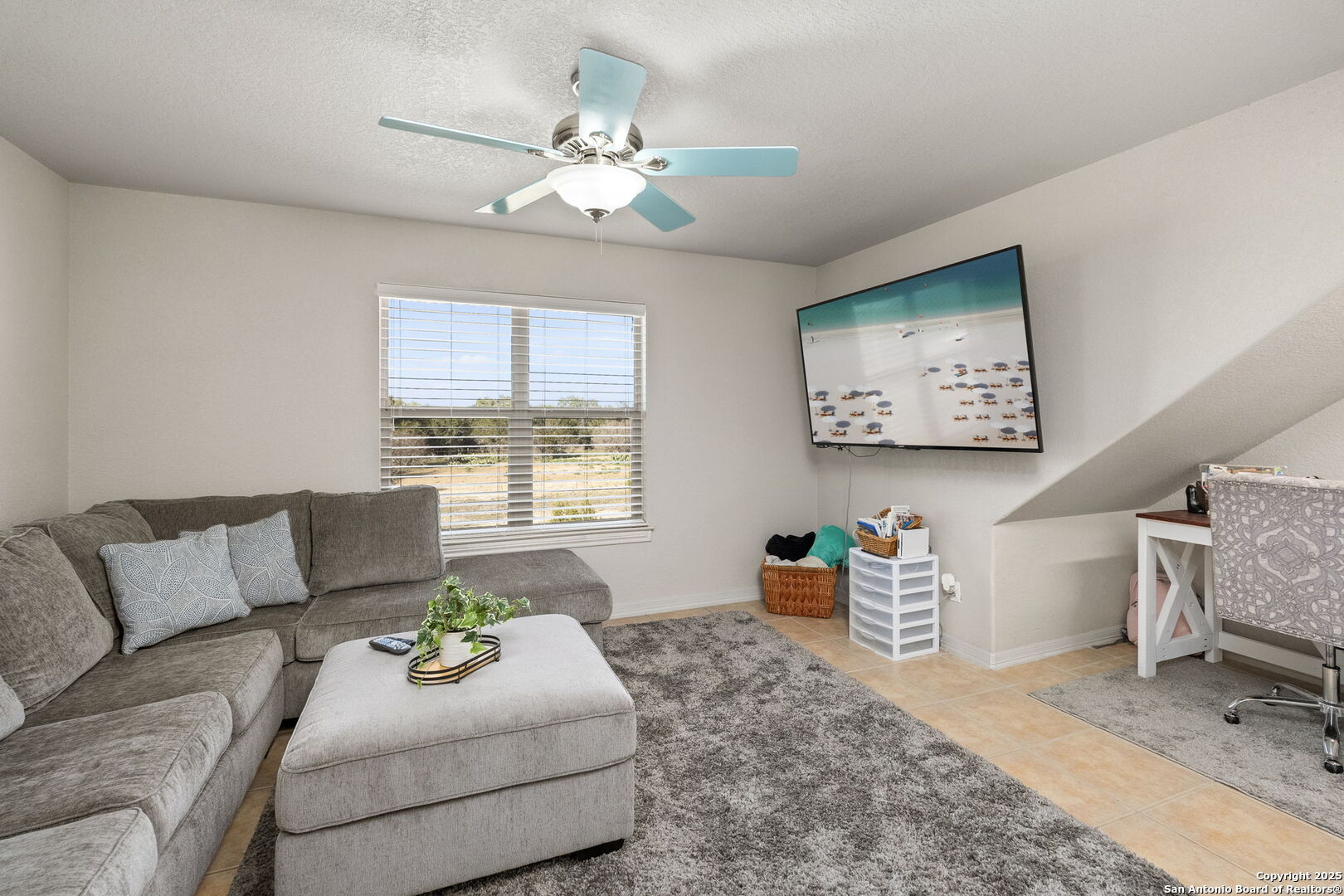 701 Kreutzberg Road Boerne, TX 78006 - Photo 30 of 43 a living room with furniture and a chandelier