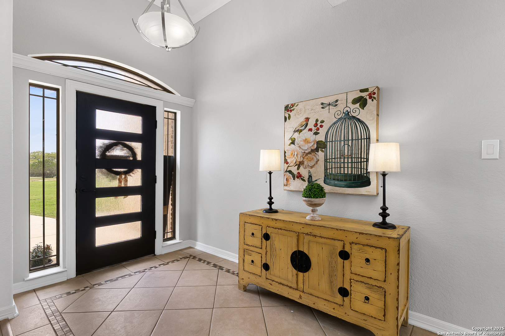 701 Kreutzberg Road Boerne, TX 78006 - Photo 3 of 43 a kitchen with stainless steel appliances granite countertop a stove and a wooden floor