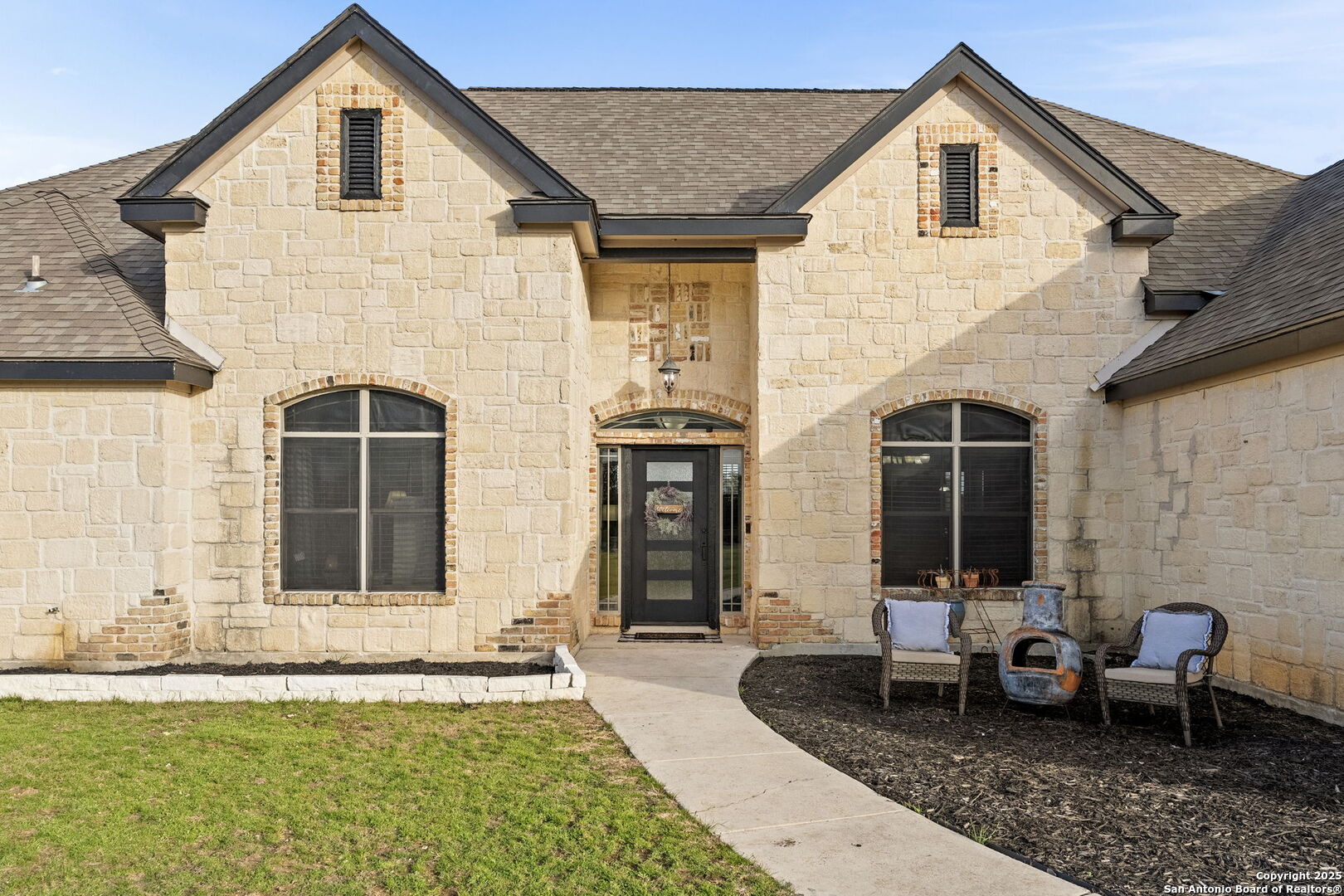 701 Kreutzberg Road Boerne, TX 78006 - Photo 5 of 43 a front view of a house with a yard