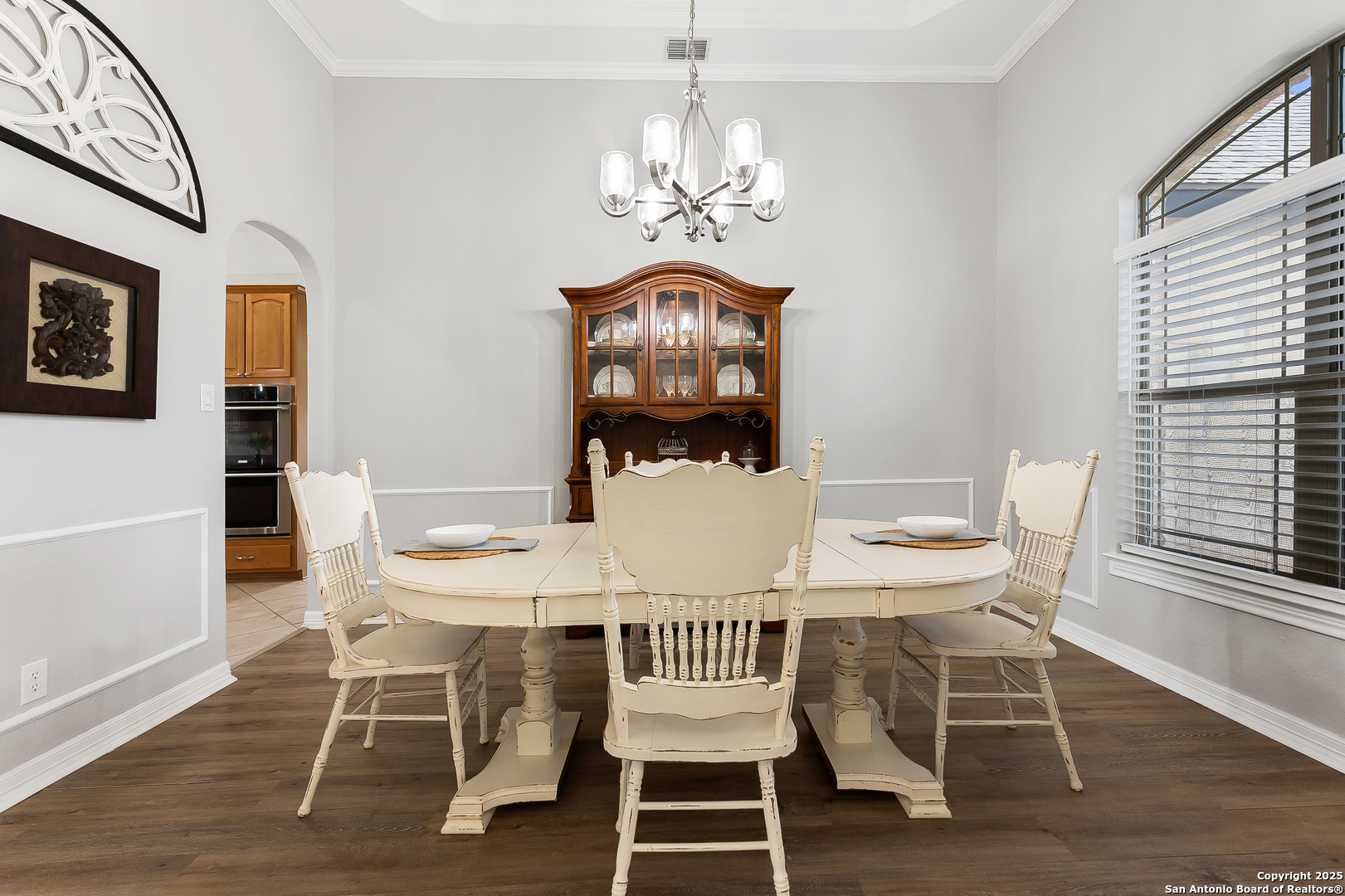 701 Kreutzberg Road Boerne, TX 78006 - Photo 6 of 43 a view of a dining room with furniture wooden floor and chandelier