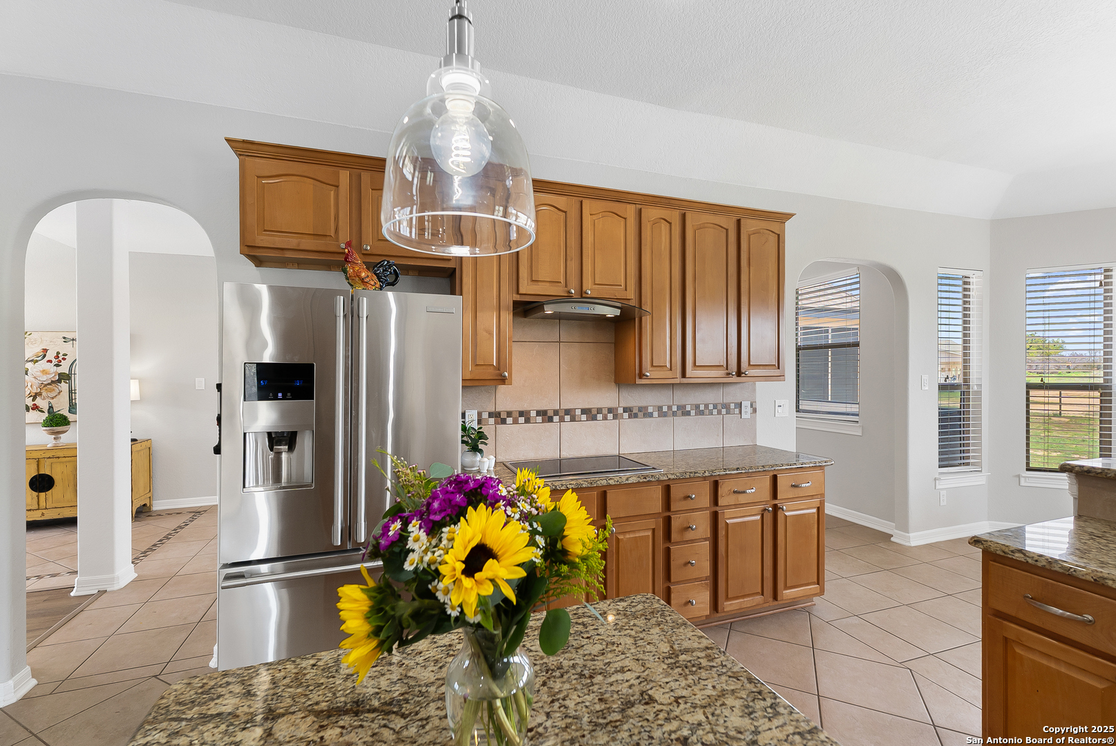 701 Kreutzberg Road Boerne, TX 78006 - Photo 8 of 43 a kitchen that has a lot of cabinets and refrigerator