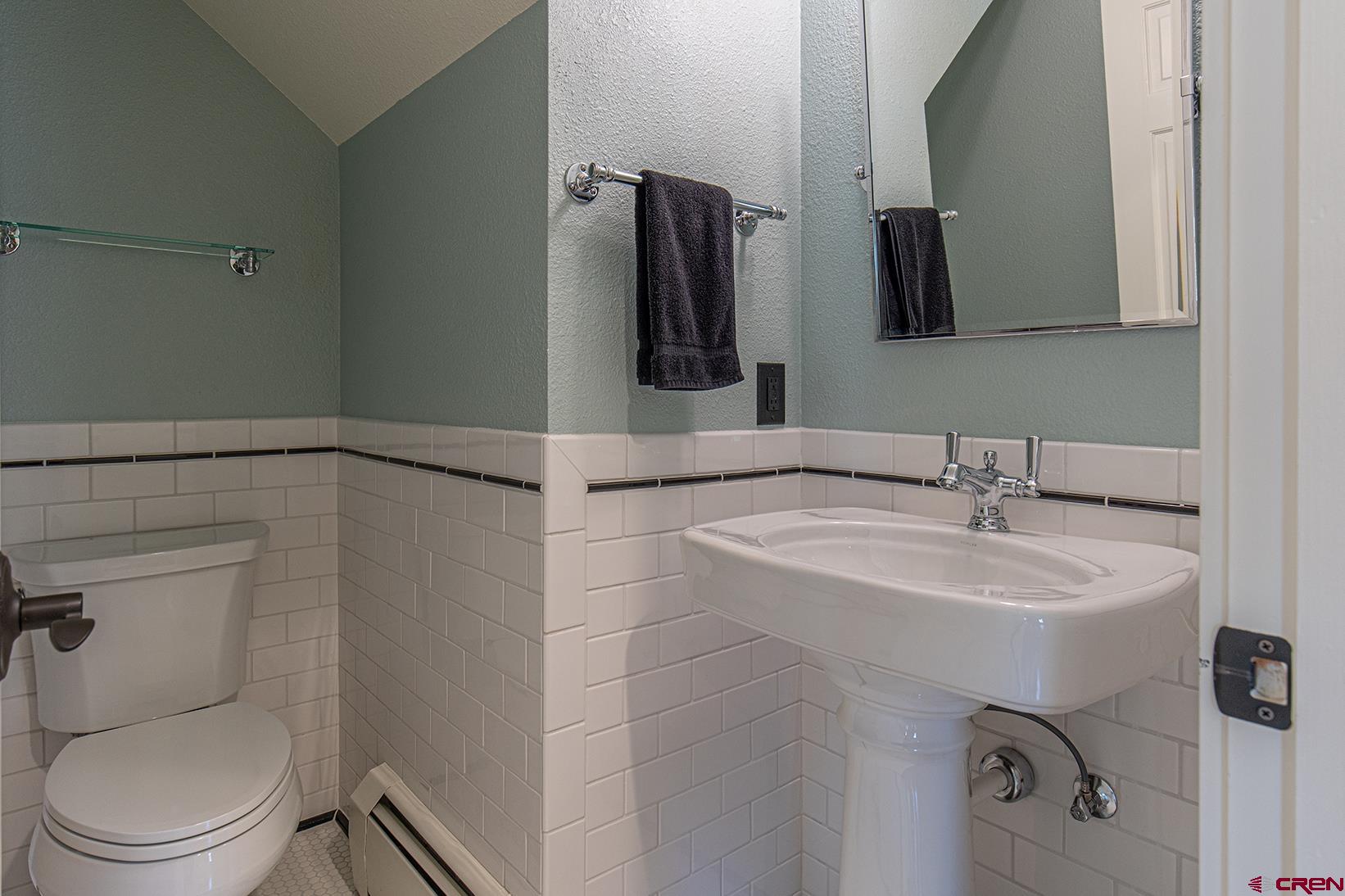 130 Hidden Treasure, Unit 1 Durango, CO 81301 - Photo 13 of 32 a bathroom with a sink toilet and mirror